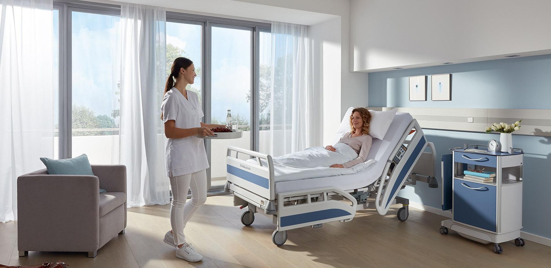 Nurse with a patient in a hospital with the windows